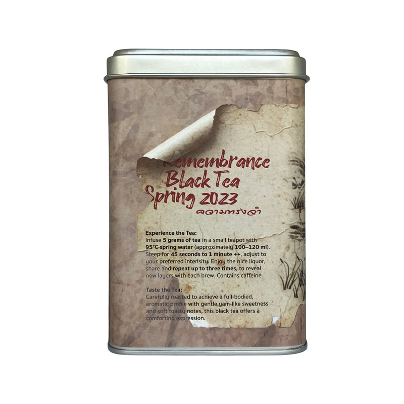 Tea canister with 'Nomenclance Black Tea Spring 2023' text on a white background